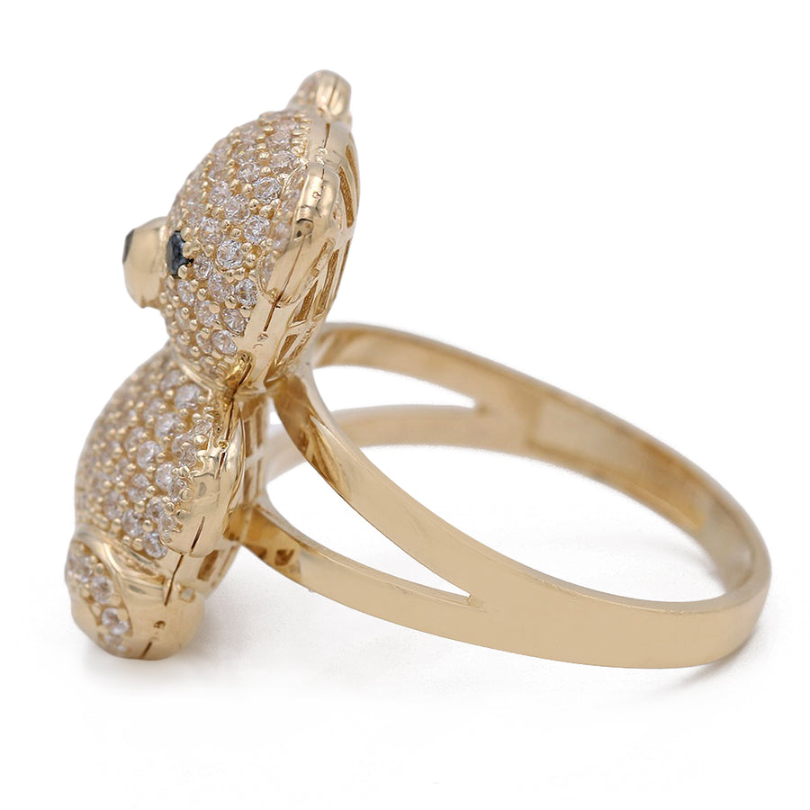 A Yellow Gold 14K Miral Jewelry Bear Fashion Ring with CZ stones.