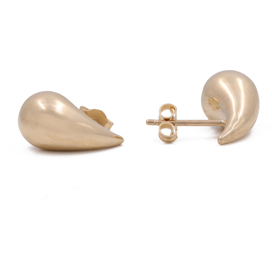 A pair of Luxurious Miral Jewelry 14K Yellow Gold Large Teardrop Earrings.