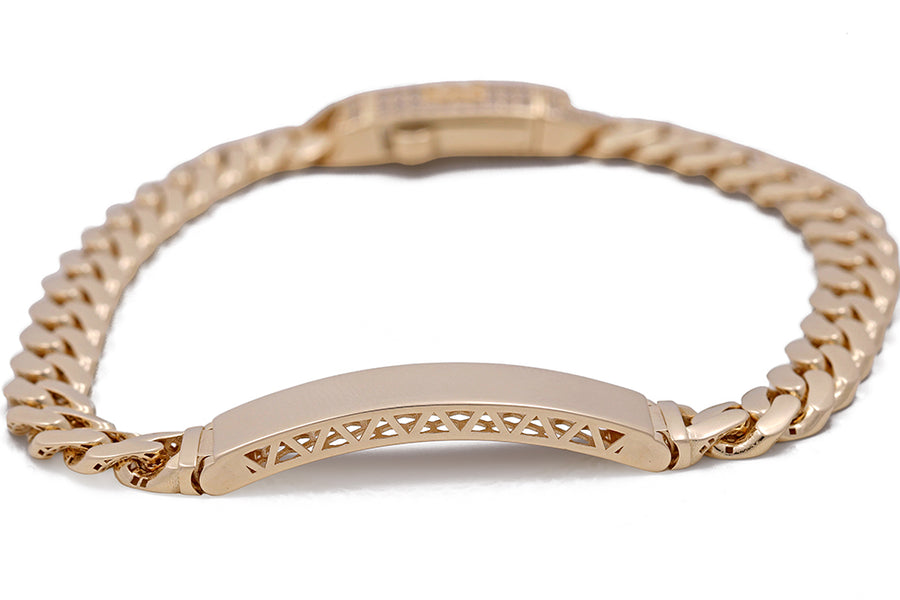 A Miral Jewelry 14K Yellow Gold Cuban Link Bracelet with Cubic Zirconias and an engraved tag.