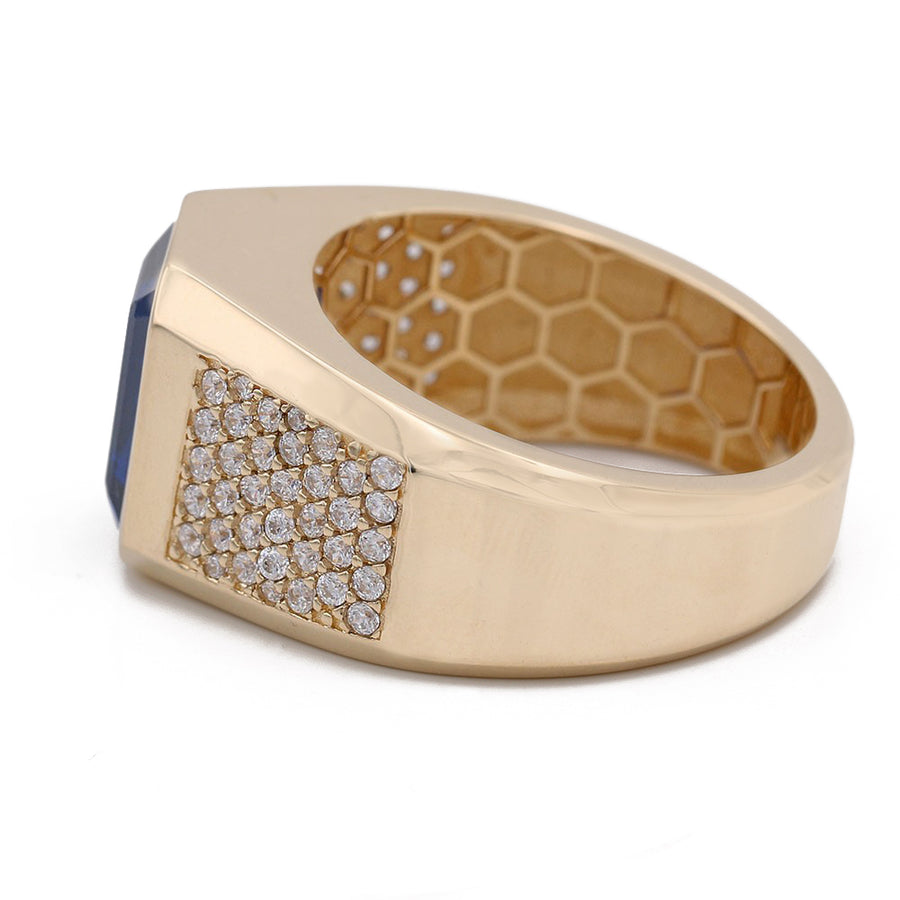 A Miral Jewelry fashion ring featuring a Yellow Gold 14k Fashion Ring With Blue Cz and diamonds.