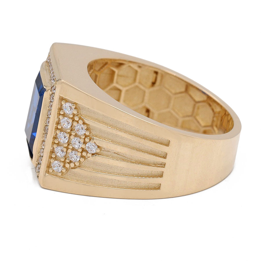 A Miral Jewelry Yellow Gold 14k Fashion Ring adorned with a blue sapphire and diamonds.