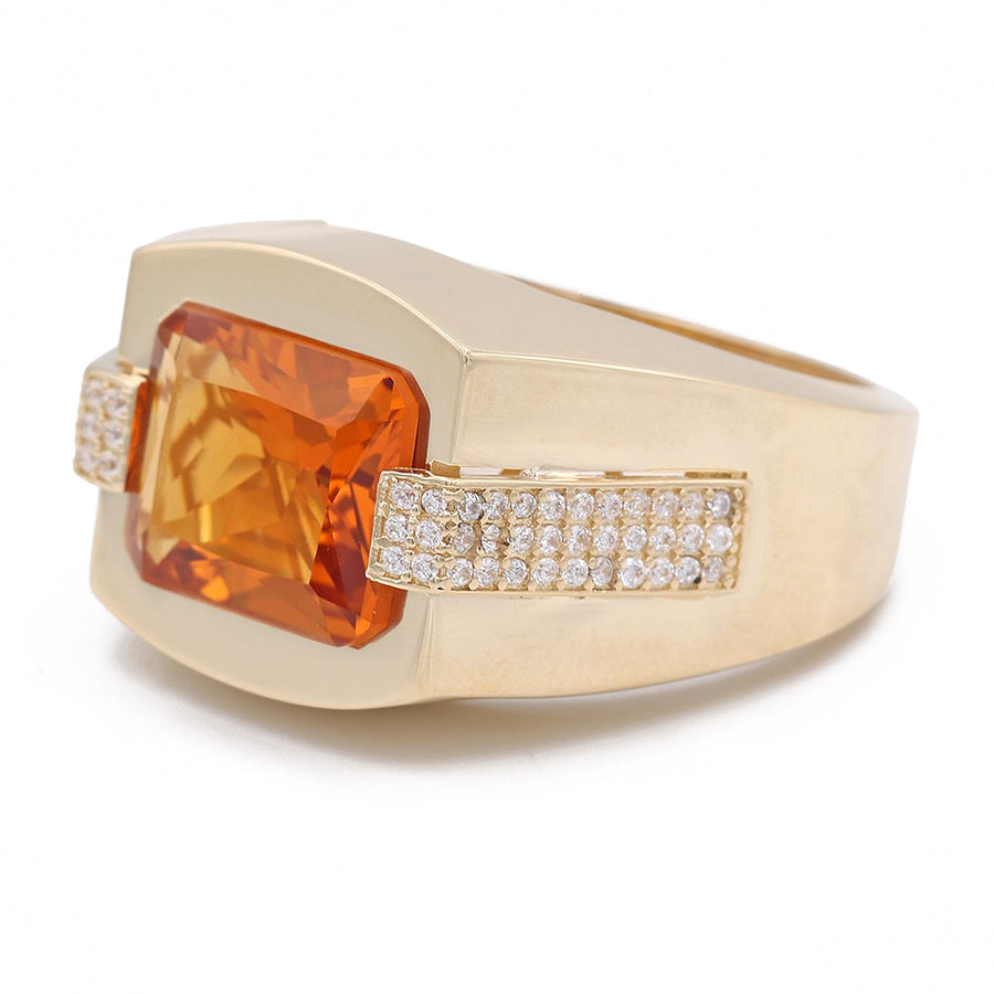 A Miral Jewelry 14K Yellow Gold Orange Color Center Stone Ring with Cubic Zirconias and diamonds.