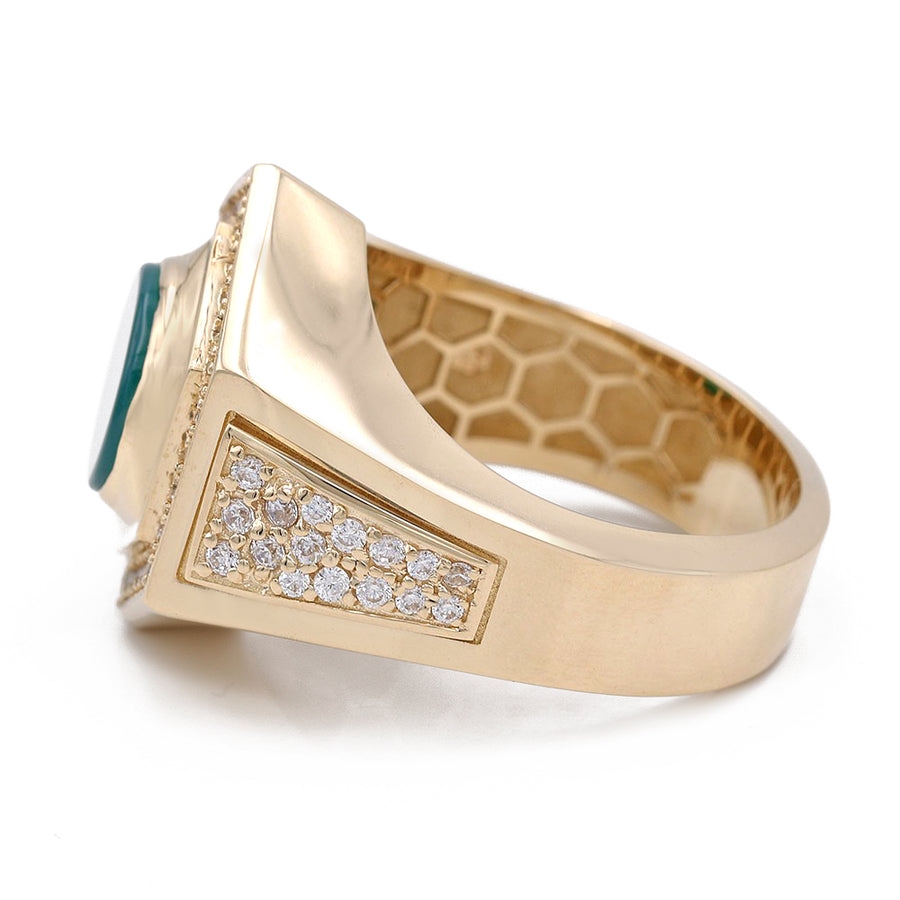 A Miral Jewelry yellow gold 14k fashion ring with a green stone and diamonds.