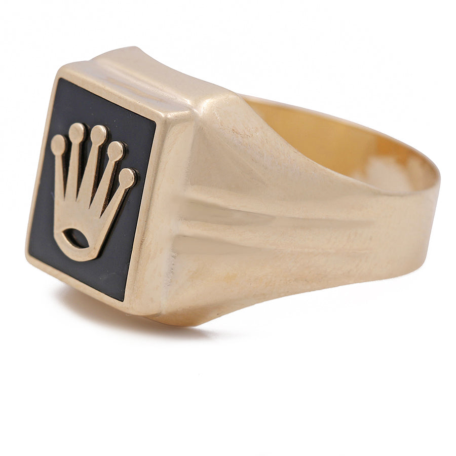 A Miral Jewelry men's gold signet ring with a crown on it.