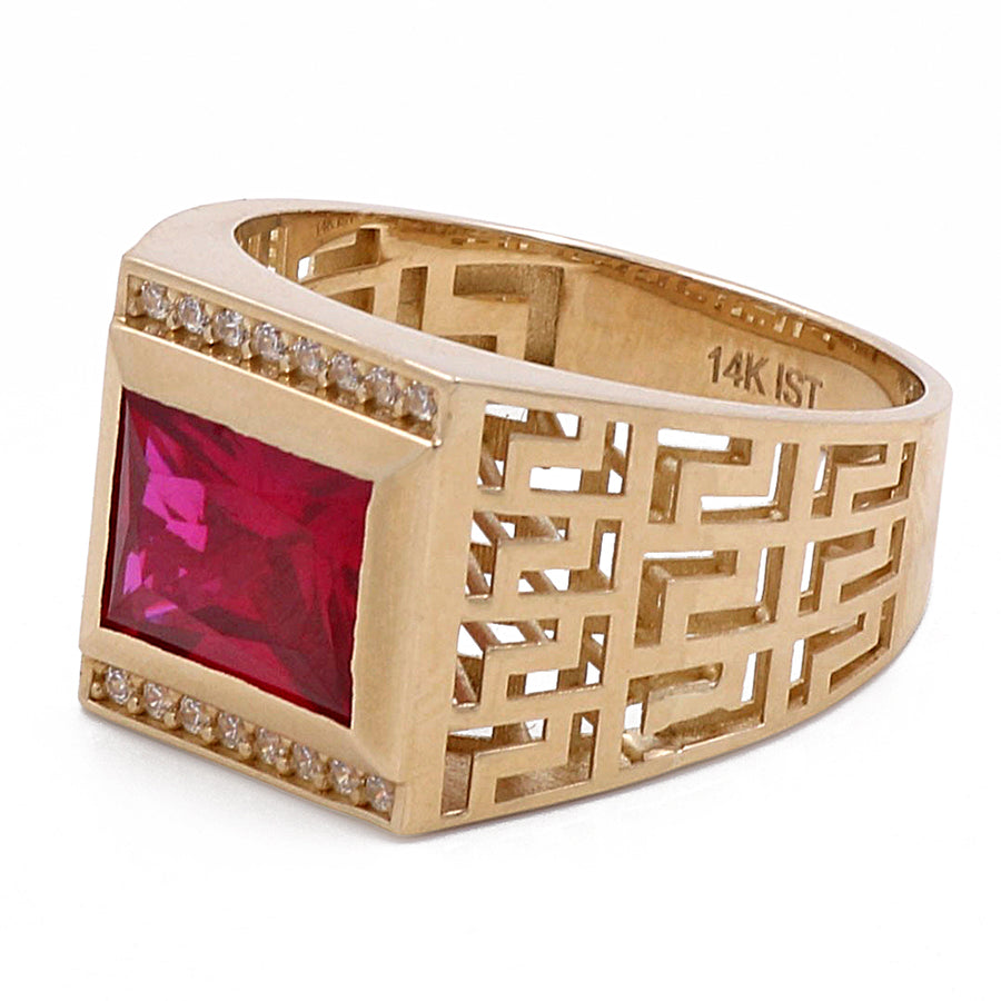 A Miral Jewelry 14K Yellow Gold Men's Fashion Ring with Red Center Stone and Cubic Zirconias.