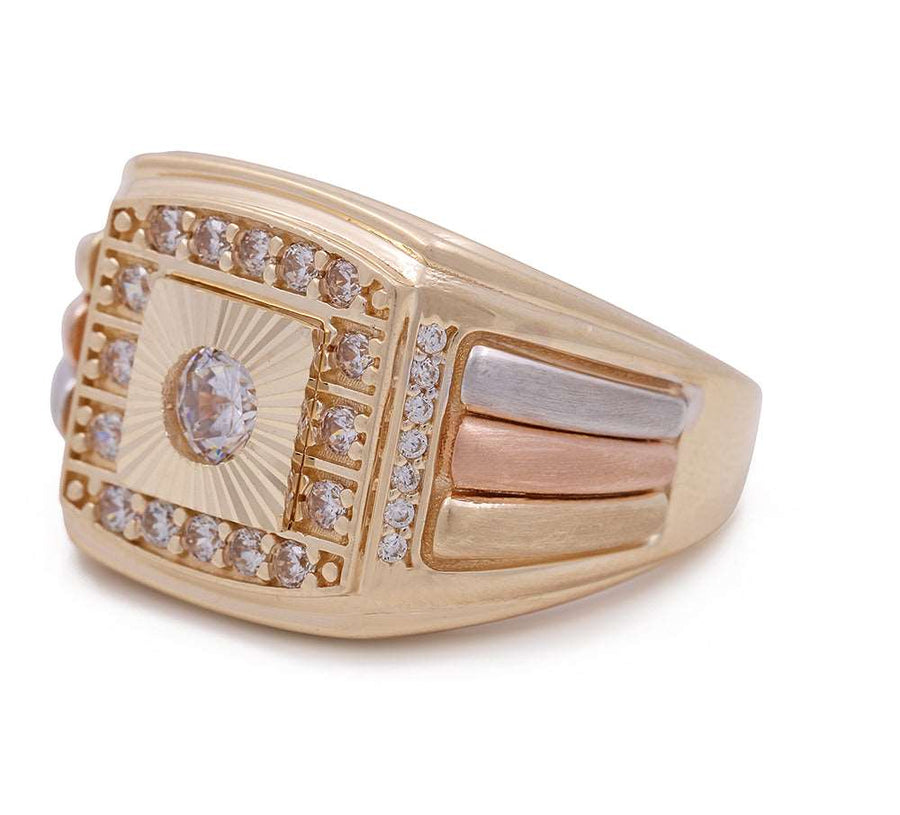 A Miral Jewelry men's tricolor gold fashion ring with three cubic zirconias on a white background.