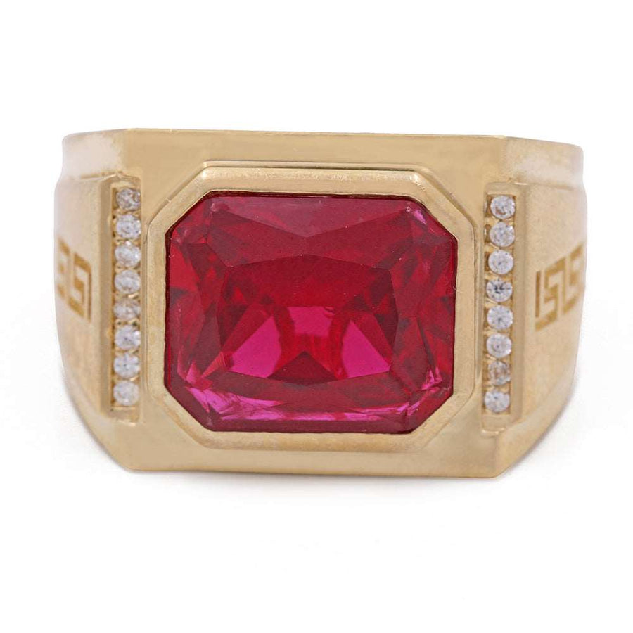 A Miral Jewelry men's fashion ring made of 14K yellow gold with a red color stone and cubic zirconias.