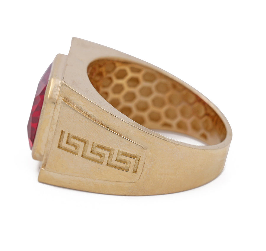 A Miral Jewelry men's fashion ring featuring a vibrant red stone set in 14K yellow gold.