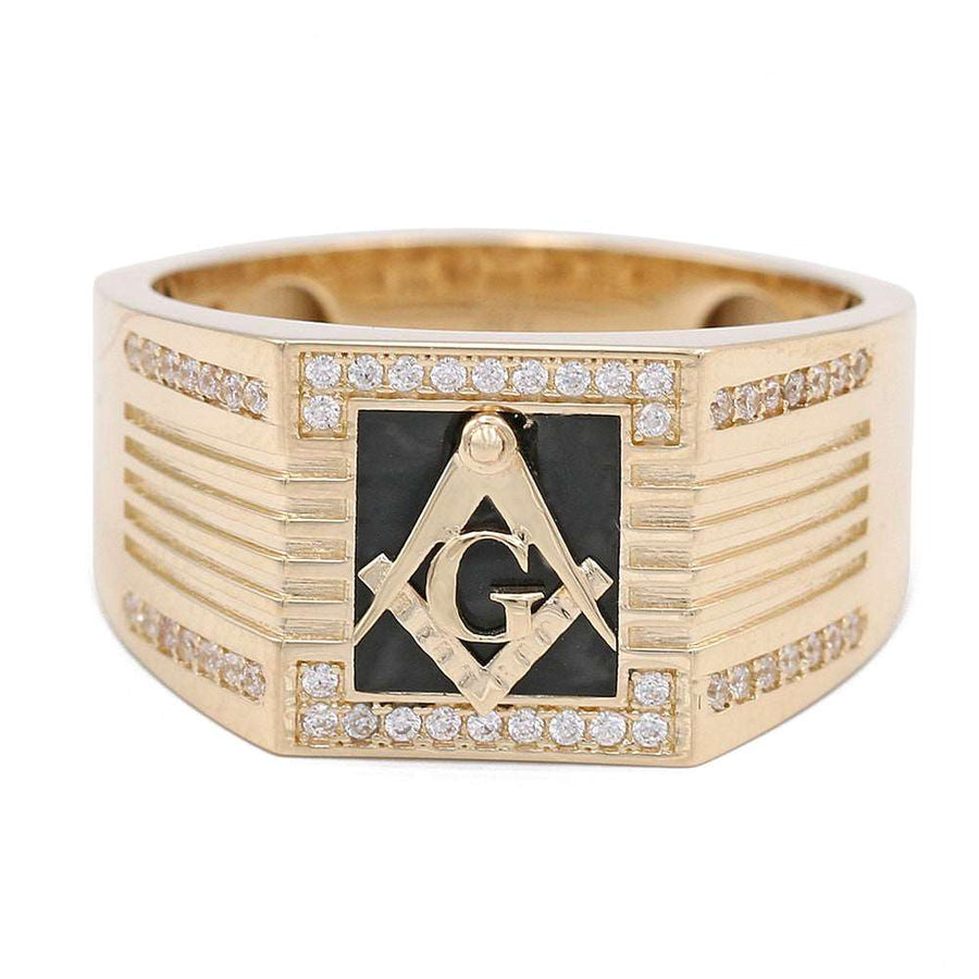 A Miral Jewelry 14K Yellow Gold Black Color Center Stone Masonic Ring with Cubic Zirconias and a masonic symbol.