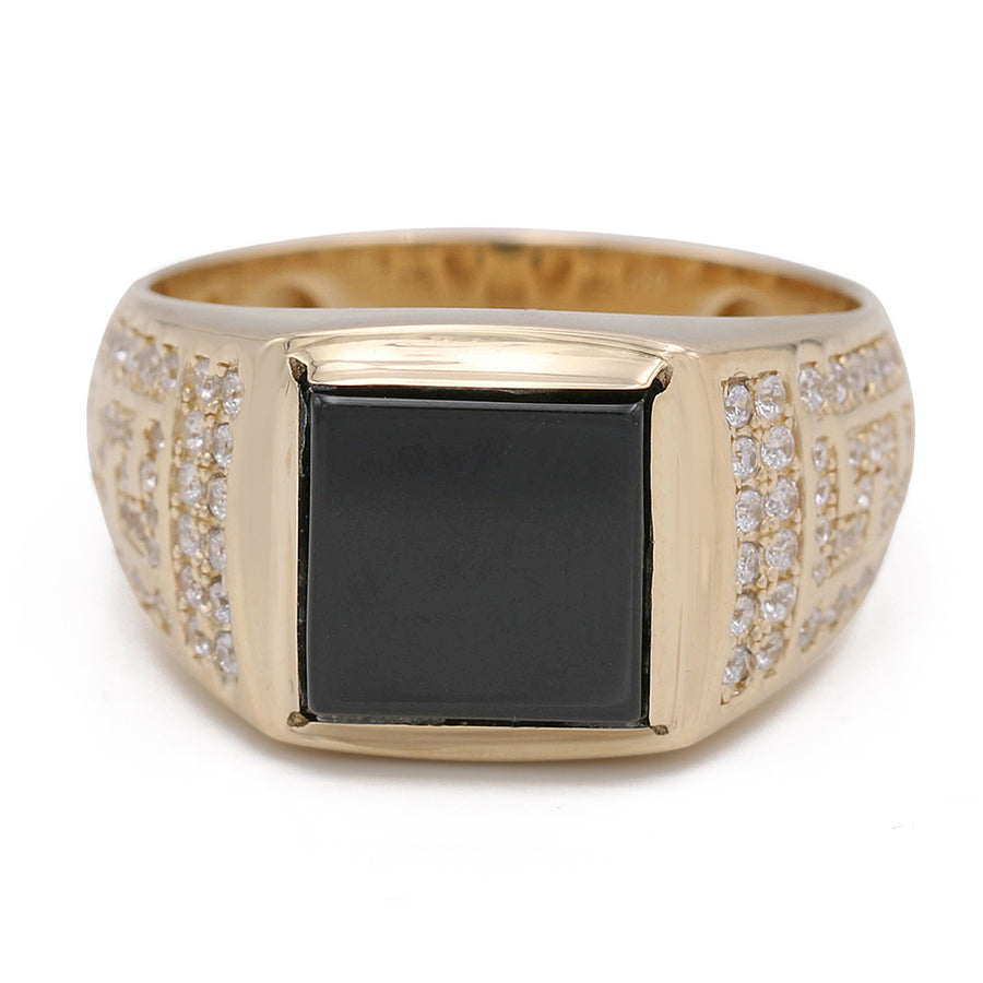 A 14K yellow gold ring with a black onyx stone and diamonds.
Product: Miral Jewelry 14K Yellow Gold Black Color Center Stone Ring with Cubic Zirconias
