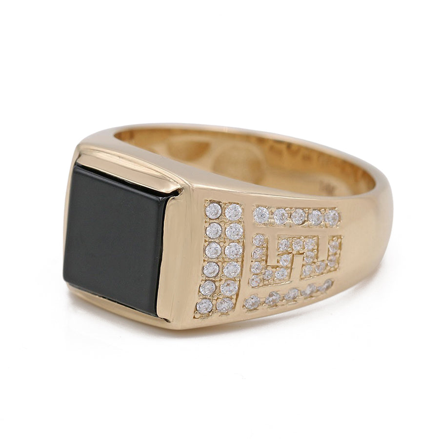 A Miral Jewelry yellow gold 14k fashion ring with a square onyx stone and diamonds.