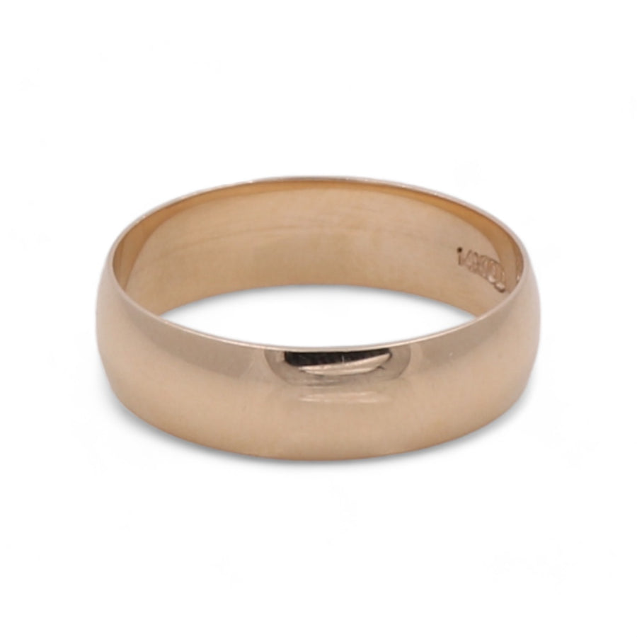 Handmade 14K Yellow Gold Men's Wedding Band by Miral Jewelry on a white background.
