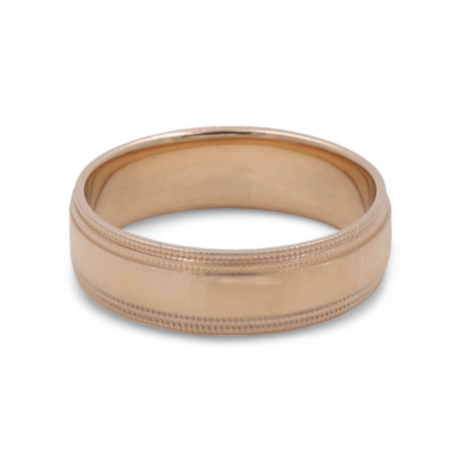 Miral Jewelry's 14K Yellow Gold Men's Wedding Band with a satin finish and milgrain edges, symbolizing enduring love.
