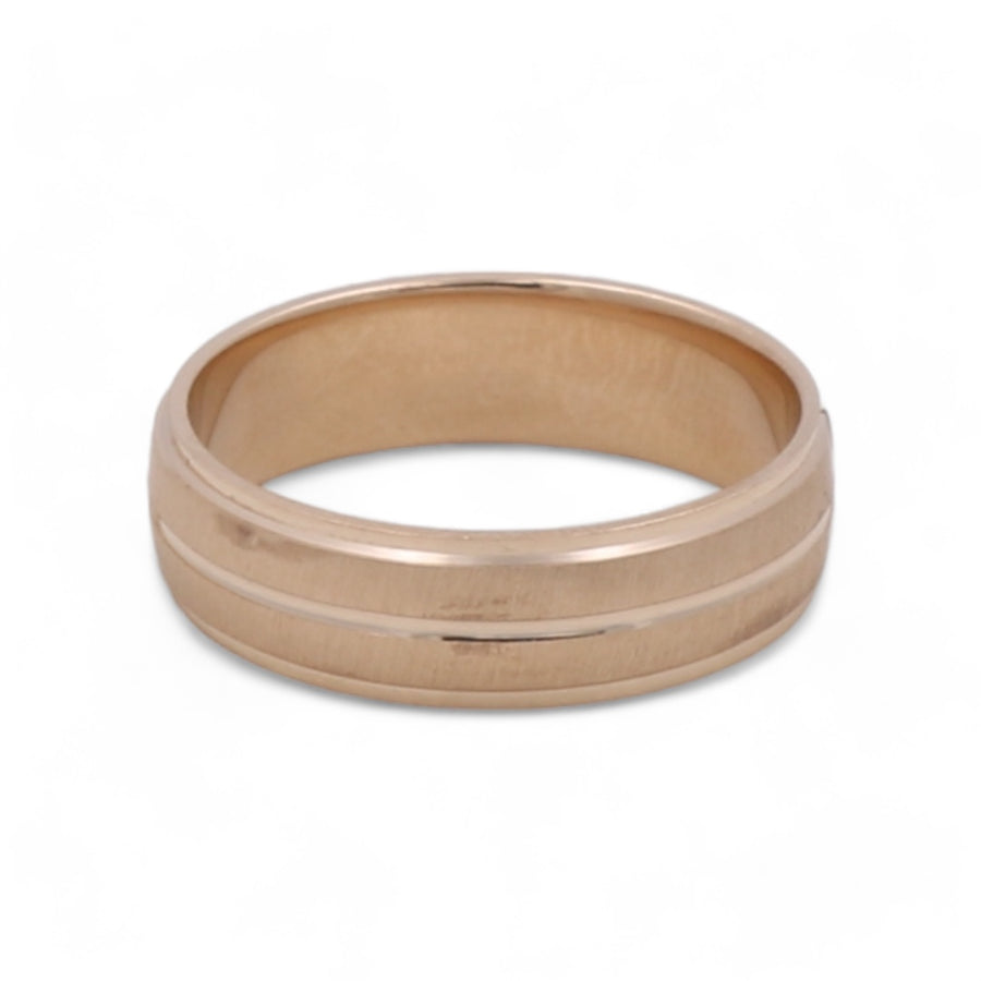 A simple Miral Jewelry 14K Yellow Gold Men's Wedding Band on a white background, radiating elegance.