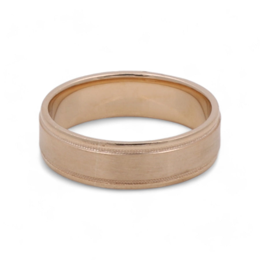 A Miral Jewelry 14K Yellow Gold Men's Wedding Band with a central groove detail.