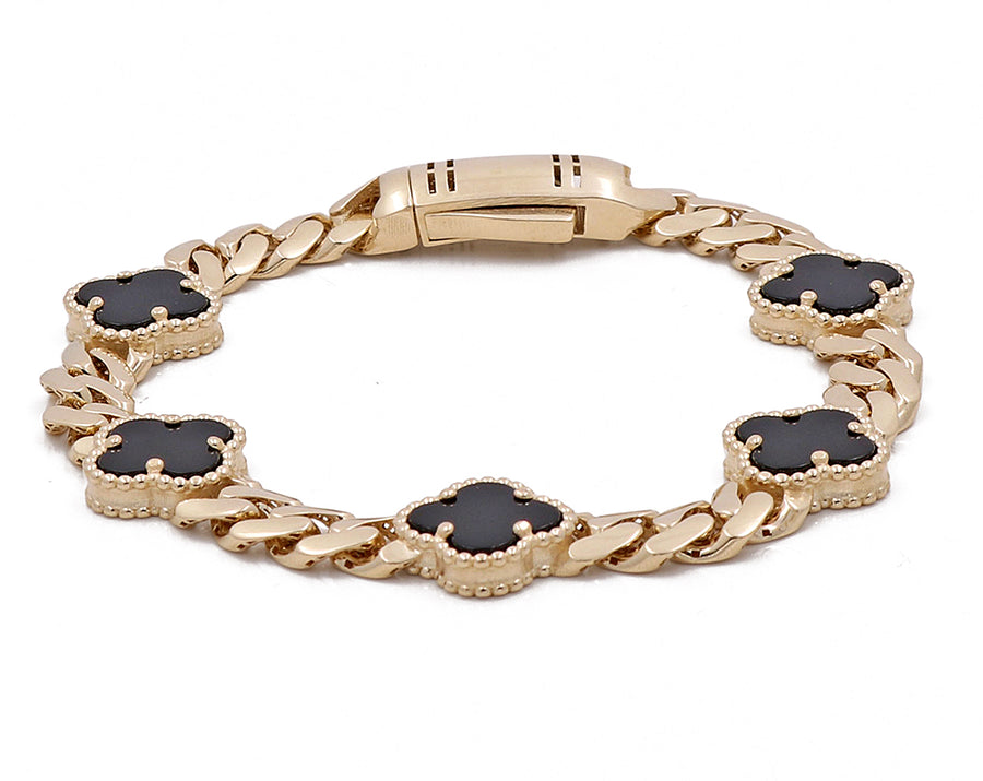 A Miral Jewelry 14K Yellow Gold Women's Fashion Onyx Flowers and Cuban Link Bracelet with pearl accents.