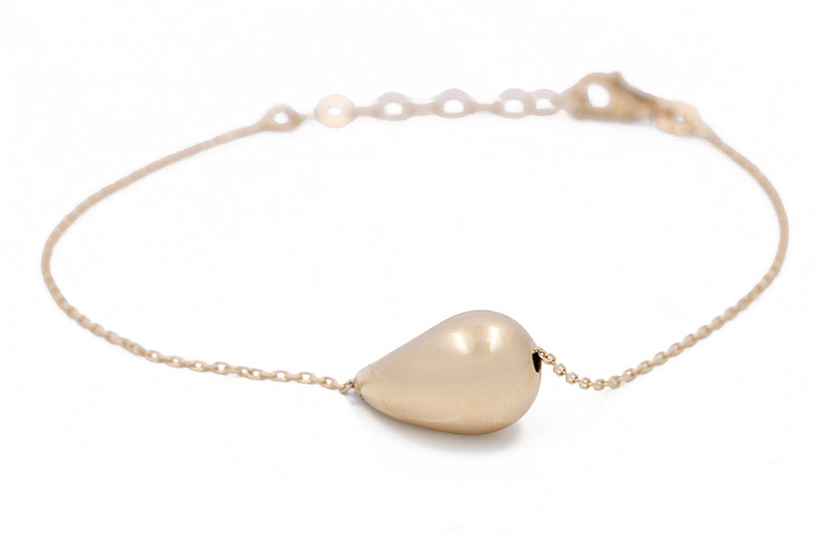 Elevate your Miral Jewelry women's fashion game with this stunning 14K Yellow Gold Women's Fashion Drop Bracelet featuring a heart-shaped pendant.