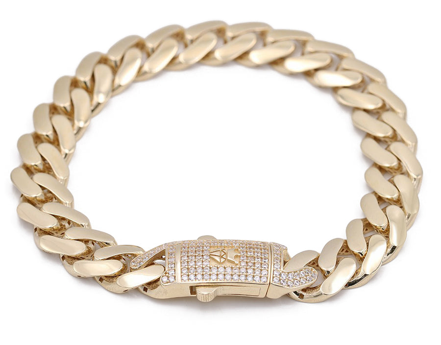 The Yellow Gold 14k Monaco Bracelet 8" Cz, featuring a stunning yellow gold cuban link design and adorned with a diamond clasp, is offered by Miral Jewelry.