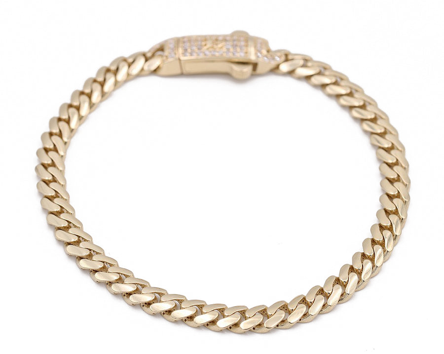 A Yellow Gold 10k Baby Monaco Bracelet 7.5" Cz with a diamond clasp and Cz stones by Miral Jewelry.