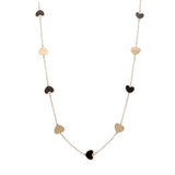 A Miral Jewelry 14K Yellow Gold Fashion Hearts Onyx and Gold Necklace with alternating black onyx-accented and gold heart-shaped charms evenly spaced along the chain.