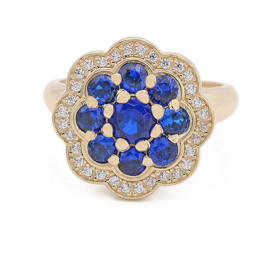 A Miral Jewelry 14K Yellow Gold Fashion Flower Shape Ring with Blue Color Stones.