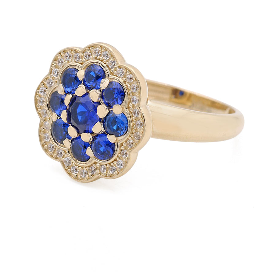 A Miral Jewelry 14K Yellow Gold Fashion Flower Shape Ring adorned with blue sapphires and diamonds.