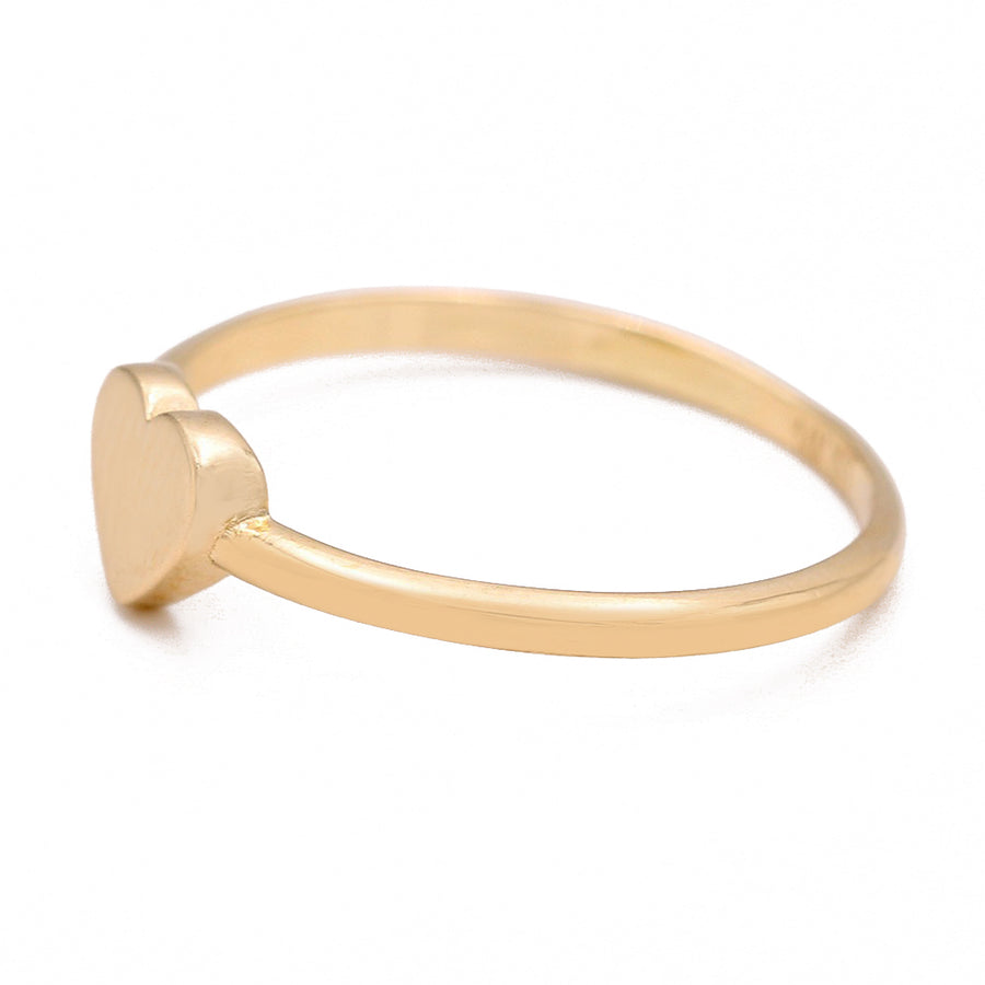 A Miral Jewelry 14K Yellow Fashion Single Heart Ring on a white background, showcasing a single heart design. Perfect for adding a touch of fashion to any outfit.