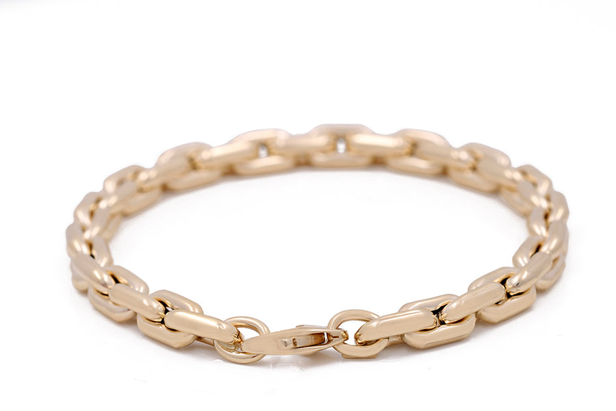 This fashionable Miral Jewelry 14K yellow gold bracelet features an oval clasp, perfect for adding a touch of elegance to any outfit.
