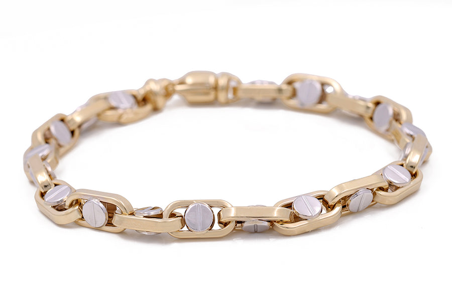 An elegant Miral Jewelry 14K yellow and white gold fashion Italian link bracelet with statement white stones.