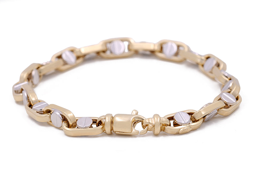 A statement Miral Jewelry Italian link bracelet made of 14K yellow and white gold.