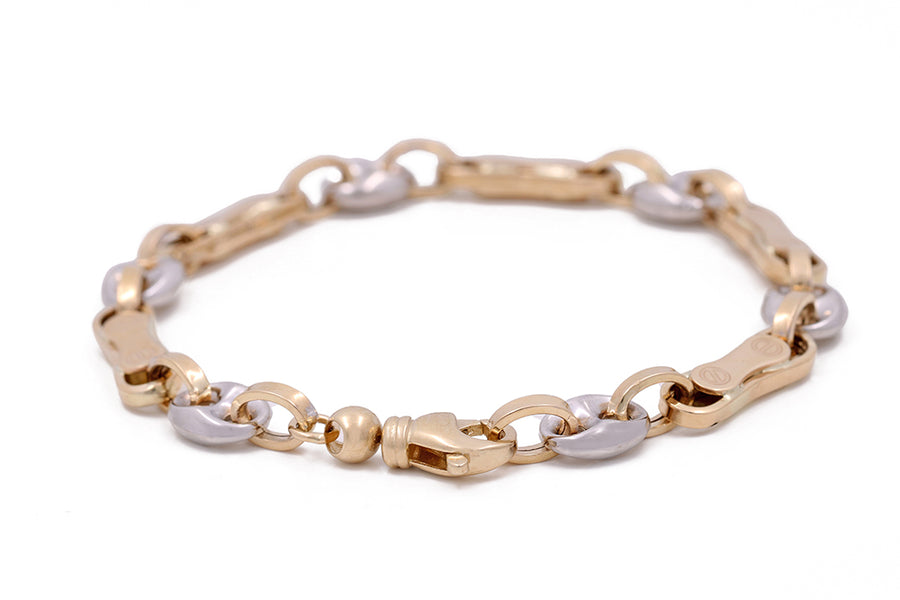 A luxury Miral Jewelry Italian link bracelet crafted from 14K yellow and white gold, showcasing a stunning combination of gold and silver chains.
