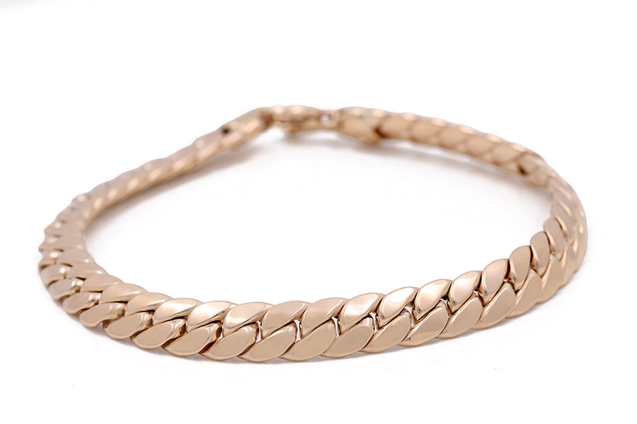High-quality 14K yellow gold Miral Jewelry Italian link figaro chain bracelet.
