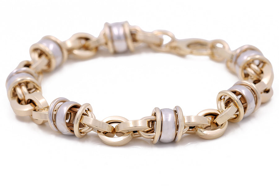 A Miral Jewelry 14K Yellow and White Gold Fashion Italian Link Bracelet with white pearls.