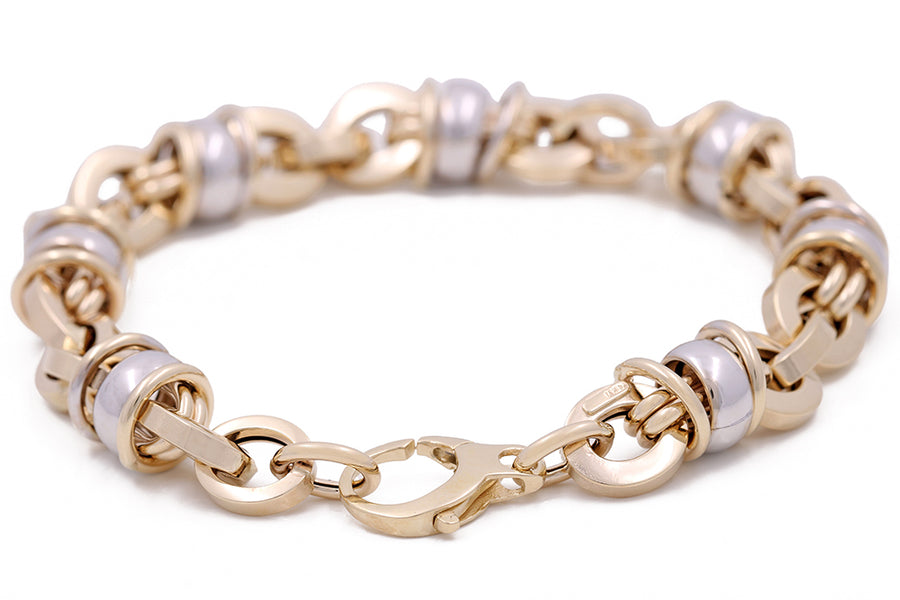 A Miral Jewelry 14K Yellow and White Gold Fashion Italian Link Bracelet with two Italian link.