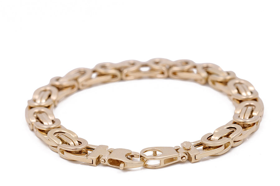 An Italian Miral Jewelry 14K yellow gold link chain bracelet with a clasp, crafted in 14K yellow gold.