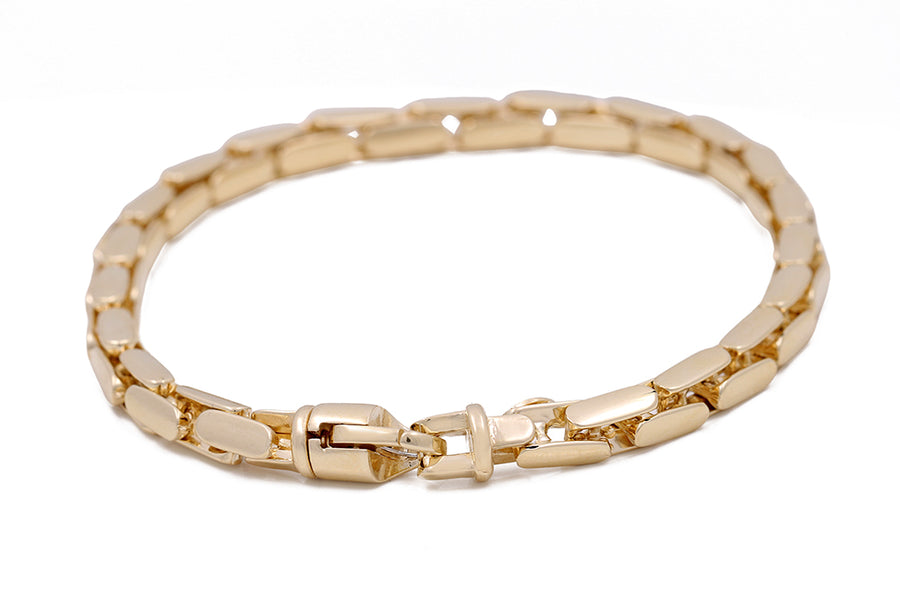 An elegant Miral Jewelry 14K Yellow Gold Fashion Italian Link Bracelet with a clasp, perfect to enhance any jewelry collection.