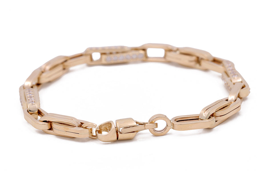 A Miral Jewelry 14K Yellow Gold Fashion Italian Link Bracelet with Cubic Zirconias crafted in 14K yellow gold with a diamond clasp.