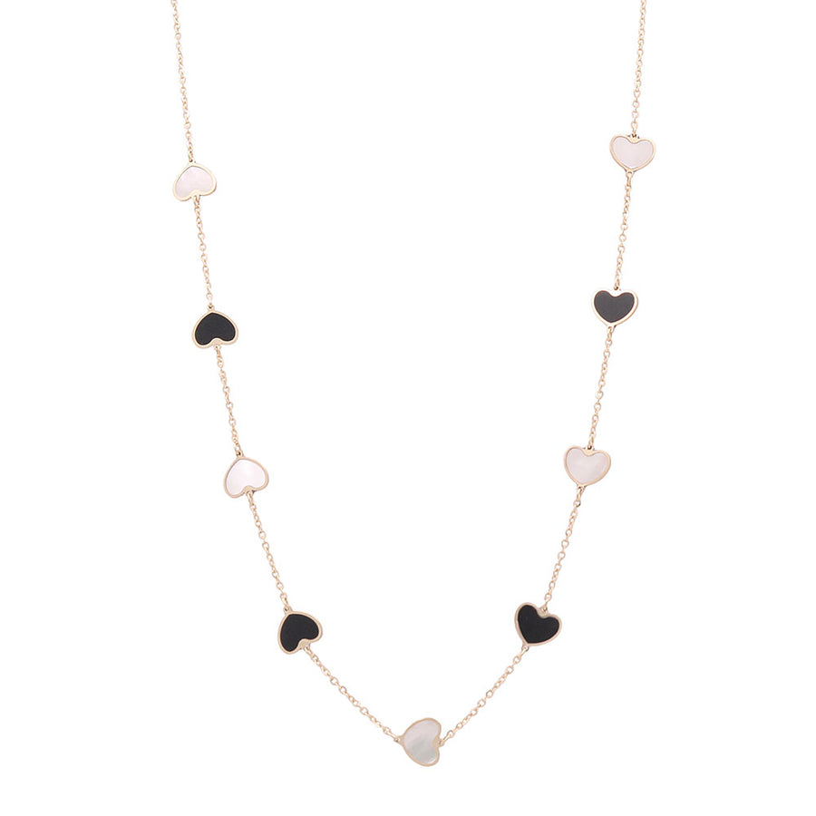 A Miral Jewelry 14K Yellow Gold Fashion Hearts Necklace with Black Onyx and Mother Pearl.