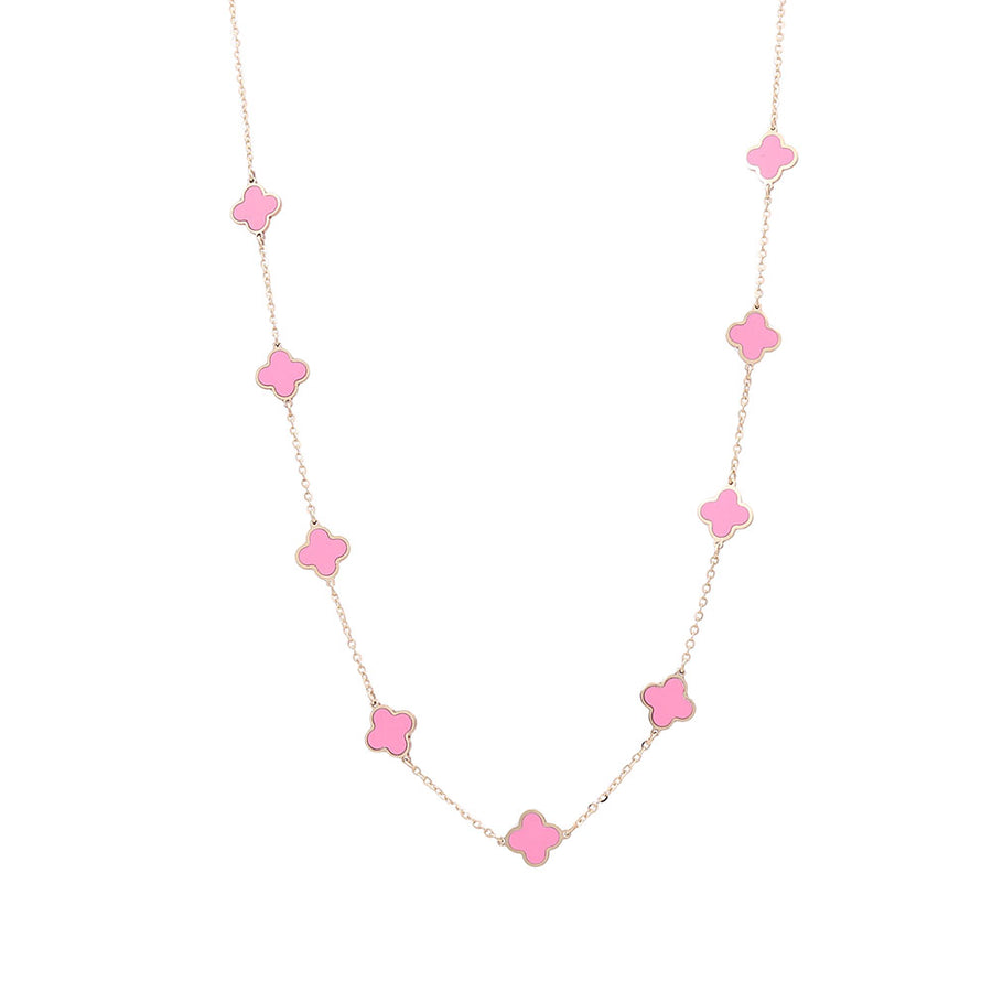 A pink and yellow gold Miral Jewelry necklace with pink stones.