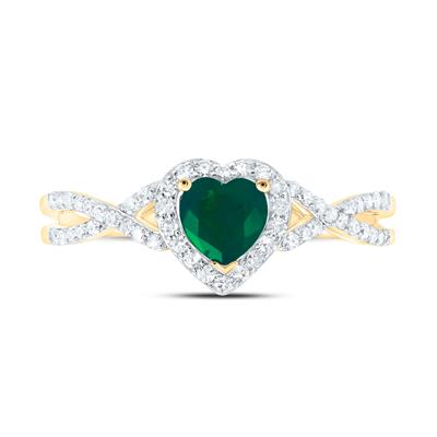 A 10k yellow gold heart emerald fashion ring with diamond accents from Miral Jewelry.