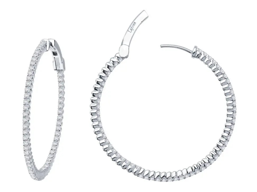 Two Miral Jewelry sterling silver Hoop Earrings adorned with simulated diamonds, one displayed open and the other closed.
