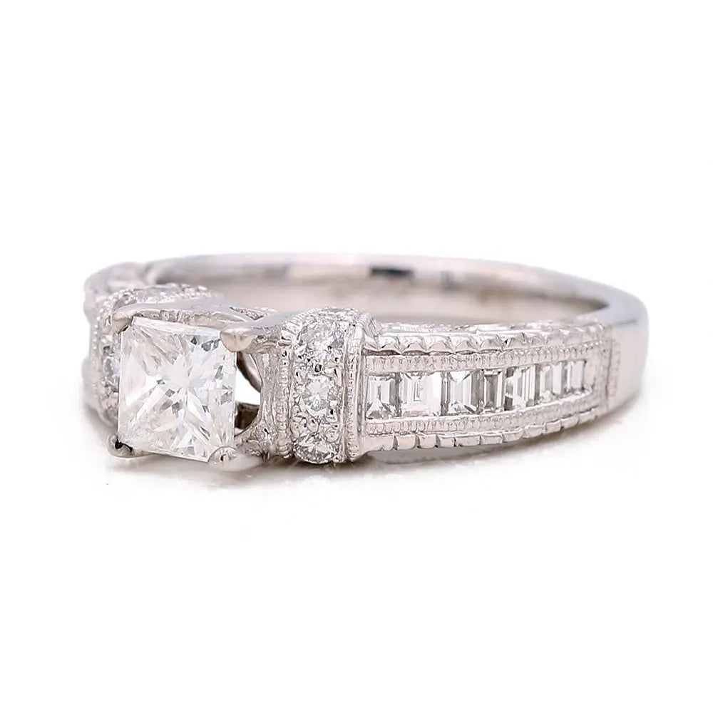 The Miral Jewelry White Gold 10k Ring is a stunning women's engagement ring, featuring a square-cut central diamond and smaller diamonds set along the band.