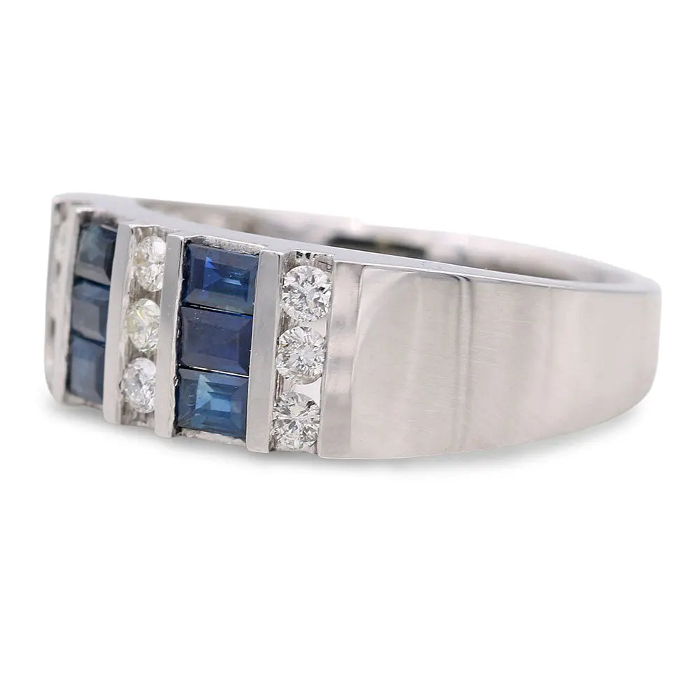 Silver band ring with a row of rectangular blue gemstones flanked by smaller round white stones set in the front, embodying the elegance of a White Gold 14k Free Form Diamond Fashion Ring With 0.10Tw Round Diamonds and Sapphires by Miral Jewelry.