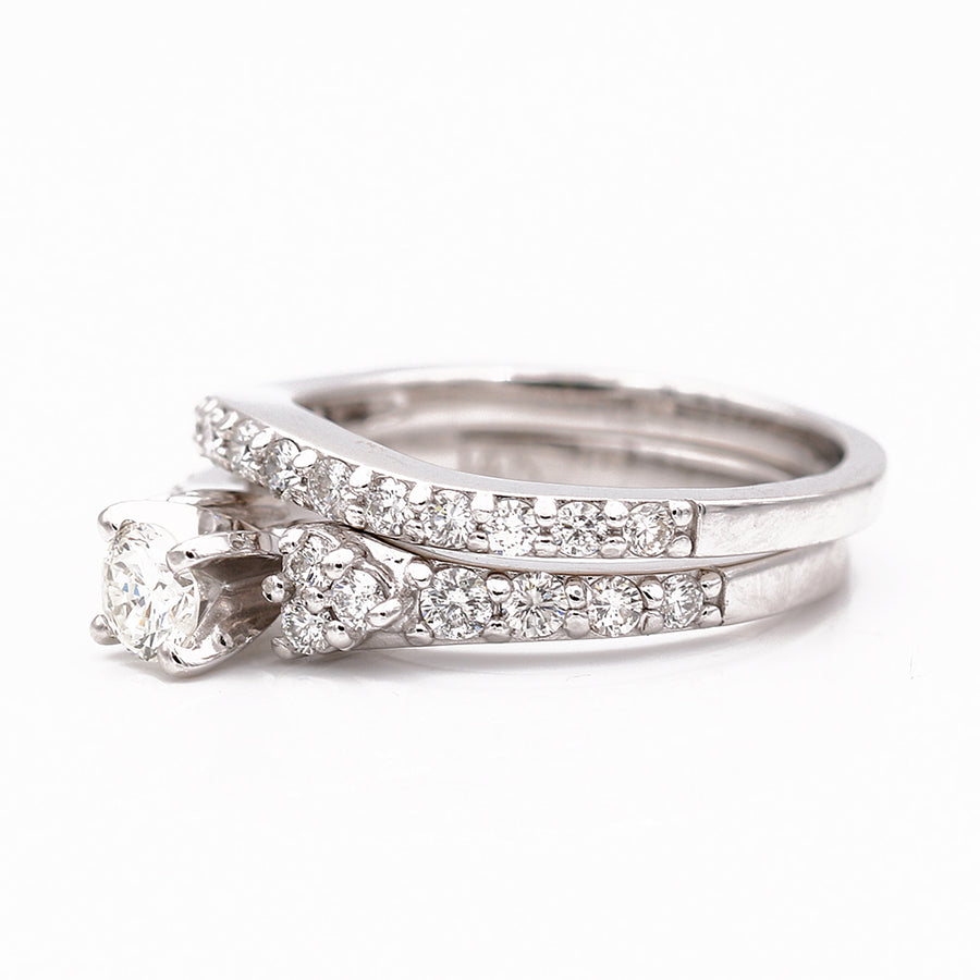 A Miral Jewelry women's White Gold 14k Bridal Set Ring adorned with exquisite diamonds.