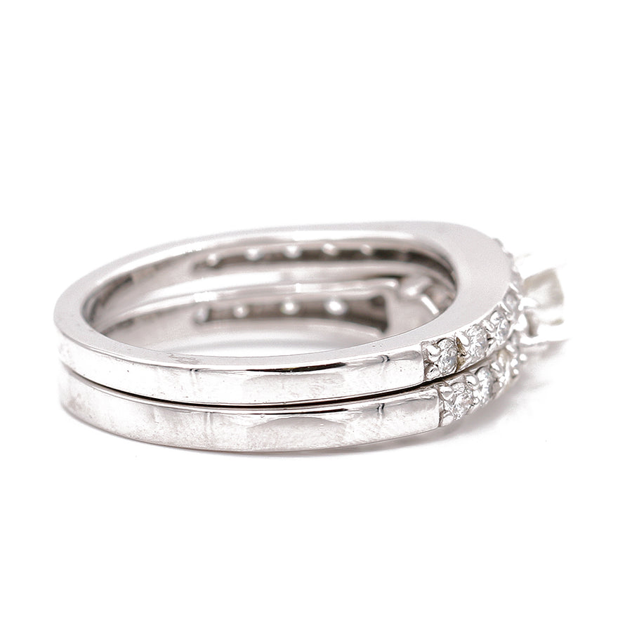 A Miral Jewelry Women's White Gold 14k Bridal Set wedding ring lavishly set with diamonds.