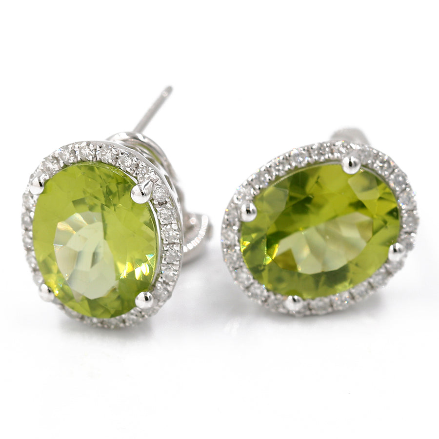 A pair of White 14K Karat Huggie Diamond Earrings With 0.33Tw Round Diamonds by Miral Jewelry.