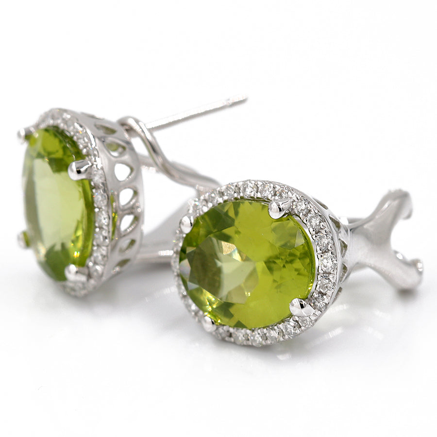 A pair of White 14K Karat Huggie Diamond Earrings With 0.33Tw Round Diamonds by Miral Jewelry.