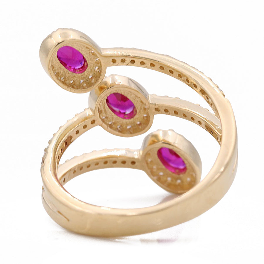 A Miral Jewelry yellow gold women's fashion ring with two pink stones.