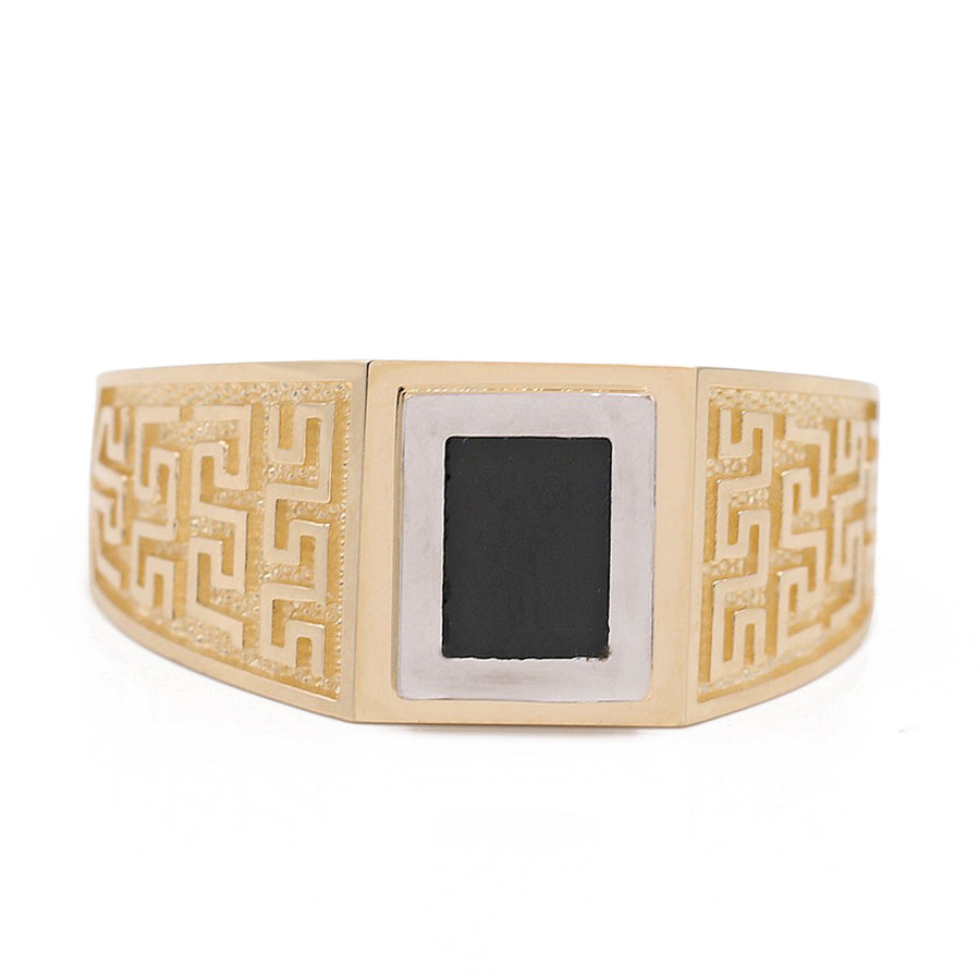 A Miral Jewelry yellow gold 14k fashion ring with an onyx stone, making it a fashionable accessory.