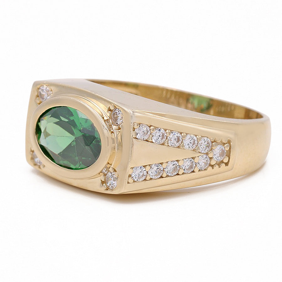 A Miral Jewelry yellow gold 14k fashion ring with a green CZ stone.